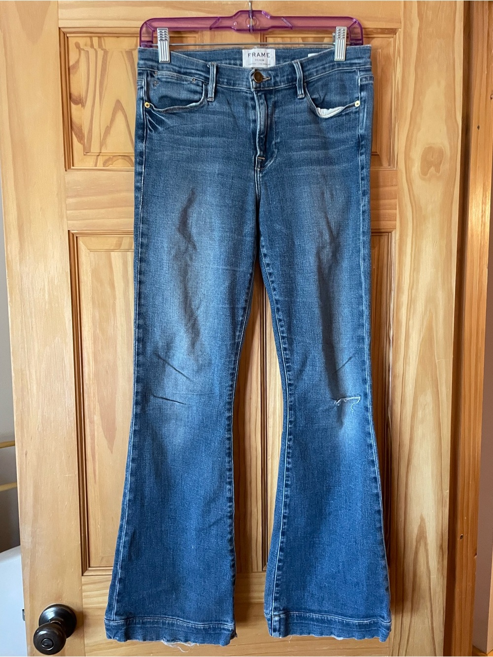 Frame Denim Blue Flare Jeans with Subtle Distressing